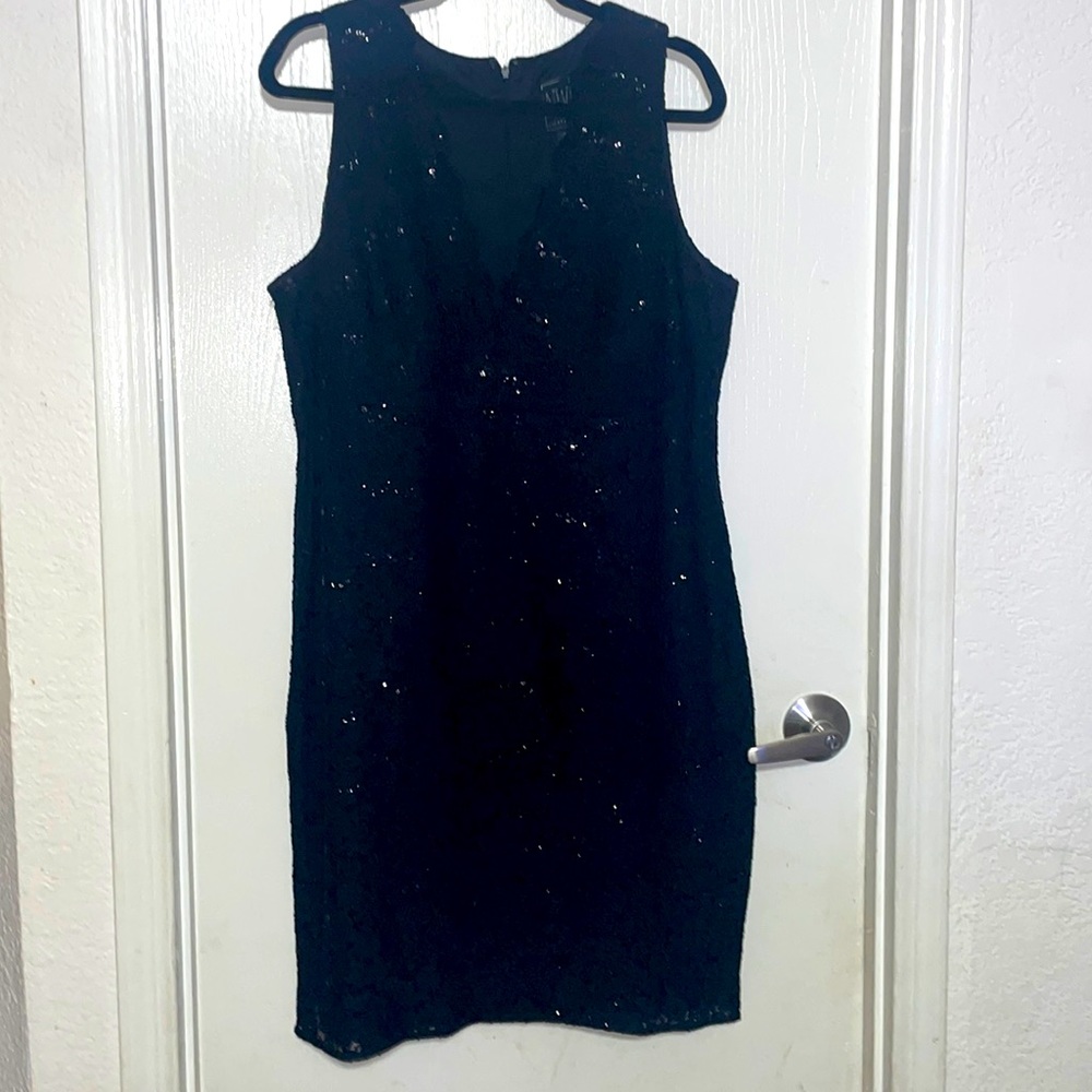 Nice dress in color black with sparkling you can see through on the front